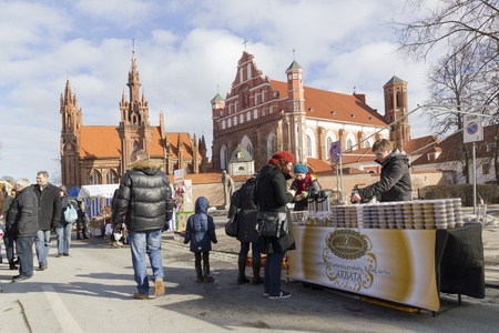 VILNIUS- MARCH 4: Fair devoted to the beginning of spring on March, 4th 2012 in Vilnius, Lithuania. Sale of homemade products,  on the background is the church of St. Anneのeditorial素材