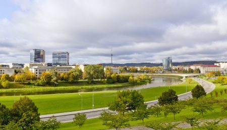 Urban Vilnius, Lithuania autumn landscape with golden maple trees and river. Cloudy gray dayのeditorial素材