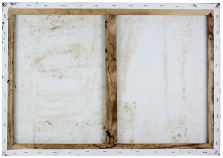 Back side view background of real old wooden frame with oil painted white canvas. Isolatedの写真素材