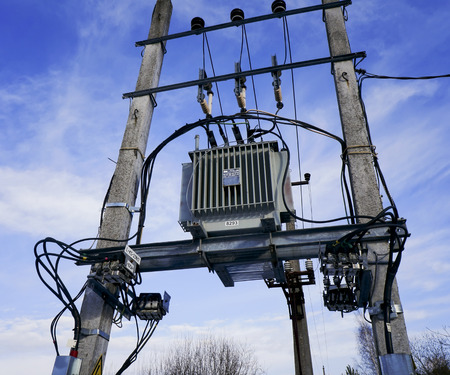 Blue heavenly sky electric transformer on a column - energy for the winter village concept.