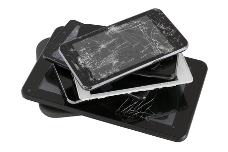 Heap of modern electronic gadgets with the broken screens. Devices are prepared for utilization....