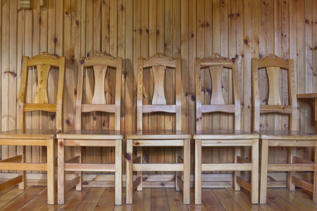 Only wooden surfaces and subjects. Chairs  wall and a floor from pine smooth boards. Indoor rural backgroundの写真素材