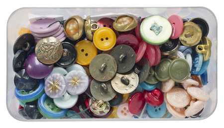 Old dusty vintage plastic buttons for repair of clothes in a box isolated