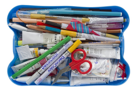 MOSCOW, RUSSIA - SEPTEMBER 17, 2015: Scrapbooking tools all best world brands in blue plastic basket - scissors, paper, brushes, tubes with paints and so on. Friendship albums and scrapbooking became popular in the 16th centuryのeditorial素材