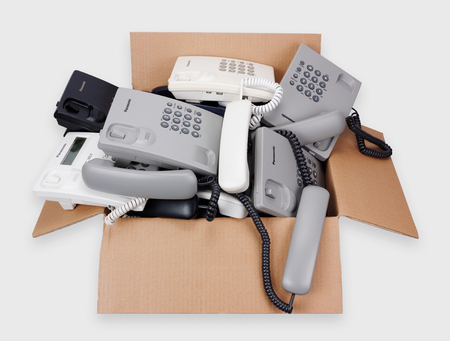 VILNIUS, LITHUANIA - JANUARY 25, 2016: A cardboard box with Panasonic cheap phones which are...