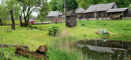 VILNIUS, LITHUANIA - MAY 15, 2016: Ethnographic museum of a retro agricultural equipment , tools and buildings in the territory of an old windmill. It is Pilaitie area- the most forest and lake district of the Lithuanian city.のeditorial素材