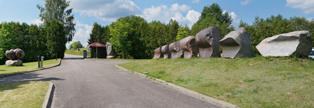 VILNIUS, LITHUANIA - JUNE 15, 2016: The central entrance in Park of Modern World  Stone Sculptures near the lake Vilnoja (Waves) . The sculptor of Vidmantas Martikonis has created this Stone Park in 2001のeditorial素材