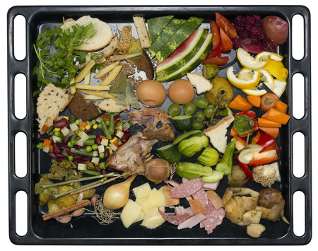 Kitchen food wastes on the black enameled pallet concept. Isolated with patch top view studio shotの写真素材