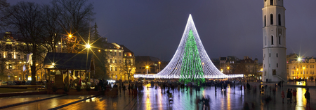 VILNIUS, LITHUANIA - JANUARY 01, 2017: Christmas den and decorated illuminate fir tree on  European old town square. People celebrate New Years  holidaysのeditorial素材