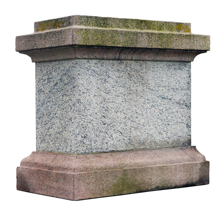 The pedestal for a statue or a column is made of roughly processed granite aged blocks. Isolated with patchの写真素材