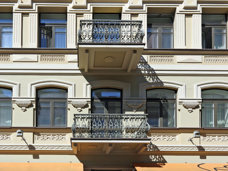 VILNIUS, LITHUANIA - JULY 27, 2017:  The balconies and wall of the ancient public building in Vilniaus Street have been restored in the style of Empire with the use of modern technologiesのeditorial素材
