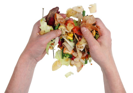 A beggar homeless man digging in a pile of food waste in a dump. Isolated on white concept top view...