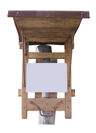 The village information bulletin board is made of wooden boards and iron rods. Isolated on white outdoor shotの写真素材