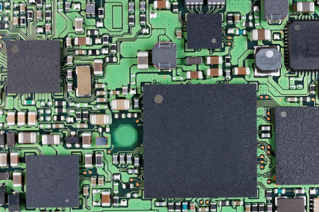 Microchips and microcircuits with ball pins are installed on a modern electronic circuit board. ...