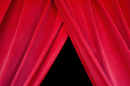 Red real velvet theater curtain closes the black stage closeupの写真素材