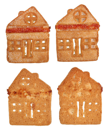 Homemade Christmas cookies in the shape of houses made of shortcrust pastry and sugar. Isolated on white studio macro setの写真素材