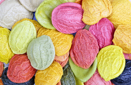 Easter pasta macaroni painted with vegetable juice in different colors.の写真素材