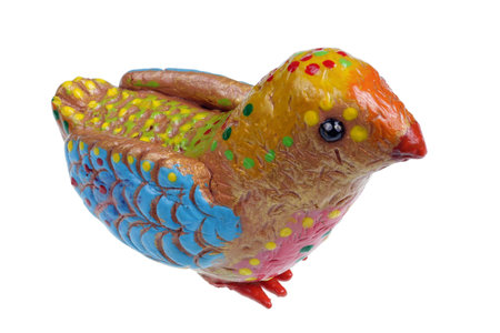 Homemade Easter small bird  in rural style made of red clay and painted with acrylic. Isolated macro studio shotの写真素材