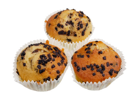 Homemade soft sweet  Easter  muffins with chocolate  in paper plates. Isolated on white studio macro shotの写真素材