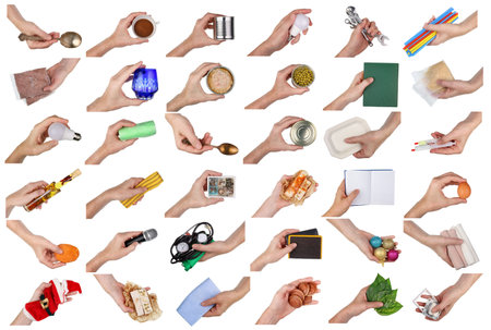 An elderly man holds in his hand a different household items and objects. Man at work  concept  . Isolated on white studio setの写真素材