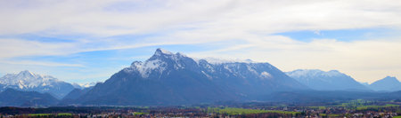 Panoramic April  European landscape with villages and mountais. Cloudy spring  day shotの写真素材