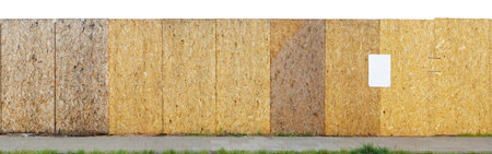 Construction site long yellow fence is made of wooden resin-impregnated chipboards. Isolated panoramic collageの写真素材