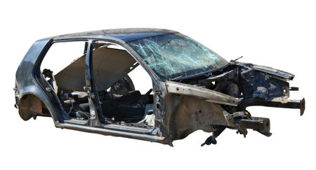Broken wrecked disassembled passenger car of an unknown mass manufacturer. Isolated outdoor object. Sunny dayの写真素材