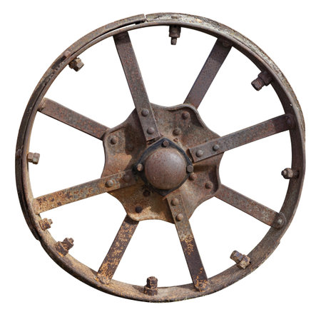 Rusty metal retro wheel from an agricultural  tractor machinery . Isolated on white  with patch outdoor objectの写真素材