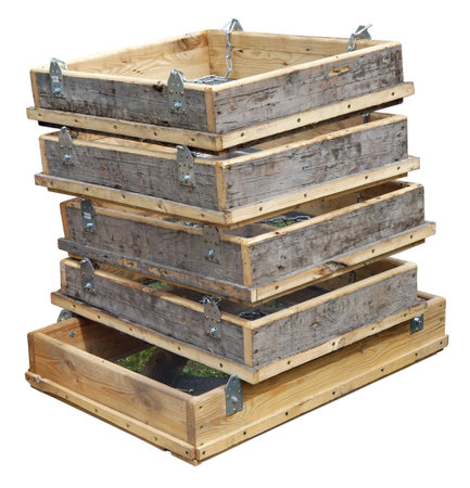 Homemade boxes with steel mesh for sifting sand in a rural construction site isolatedの写真素材