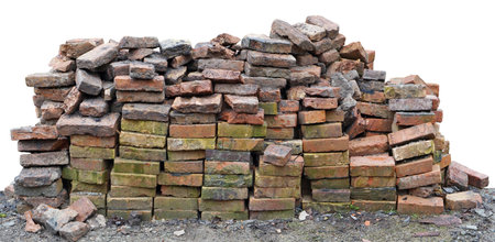Aged handmade red clay bricks heap from old rural oven. Isolated outdoor object