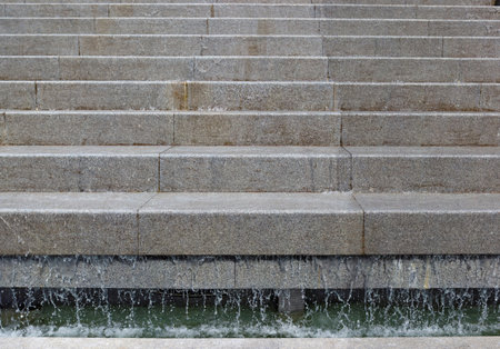The wet interior space of the workingcity fountain is adorned with gray  polished granite slabsの写真素材