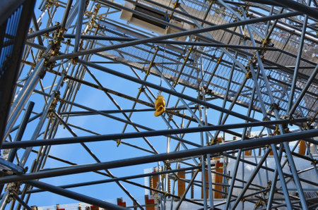 Electric winch with yellow steel hook installed on   scaffoldsの写真素材