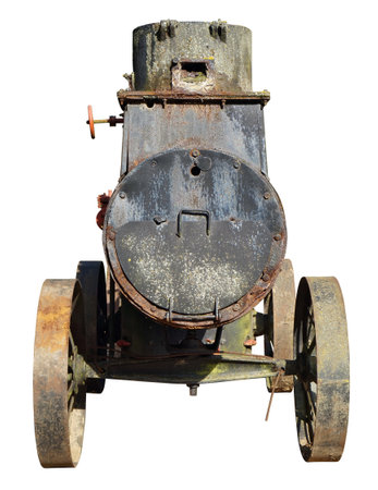 An ancient very steam locomotive used in agriculture a hundred years ago. Isolated on white