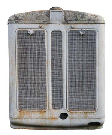 Rusty  radiator of a retro agricultural tractor. Isolated on whiteの写真素材