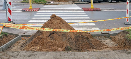 Stop tape  limit the area of repair and renovation of a street pedestrian  crosswalkの写真素材