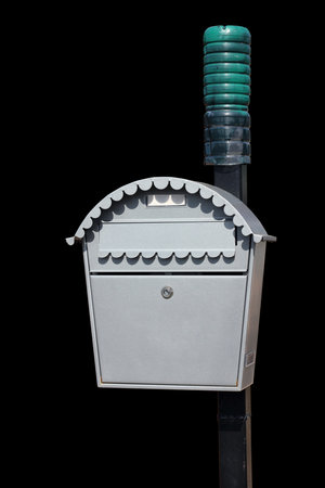 Silver homemade  metal mail box isolated on blackの写真素材
