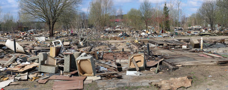 Large garbage dump in a European city panorama. An example of environmental pollution