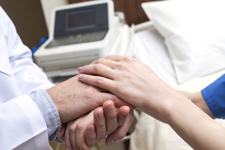 Doctor hands patient hospital