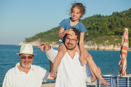 Father Daughter Shoulders Grandfather Sea Beachの写真素材