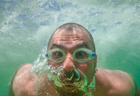 Funny Male Face Underwater Gogglesの写真素材