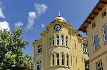  Fragment of old renovated building with town clock のeditorial素材