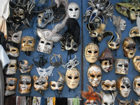 Group of theatrical masks on blue wallの写真素材