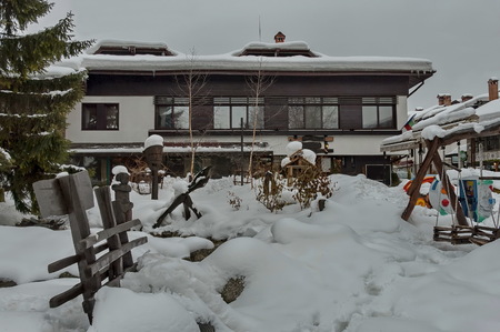 Snow winter square in the Bansko town with open-air kindergarten, Bulgariaのeditorial素材
