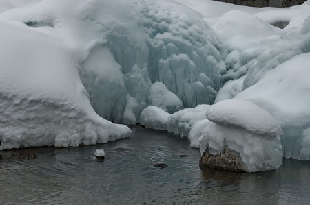Frozen karst fountain in Bansko town at winter, Pirin mountain, Bulgariaの写真素材