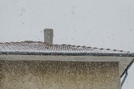 Fragment of building outdoor with heavy snowfall in winter, Zavet, Bulgaria