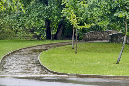 Stone bridge on a pedestrian path over the Bistritsa River after a rain in Rila Park near the town ...