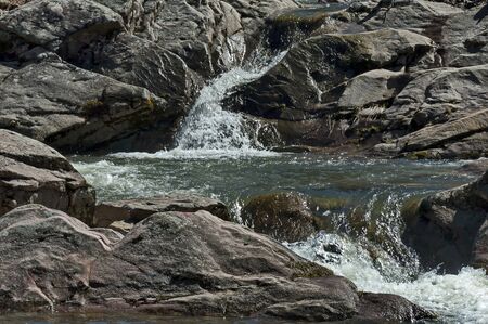 Wonderful scenery with mountain river flowing to large rocks and stones, Teteven town, Bulgaria,...