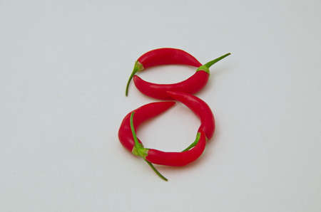 Sign 8, made from the fruit of fresh chilli red pepper with a green stalk, Sofia, Bulgaria