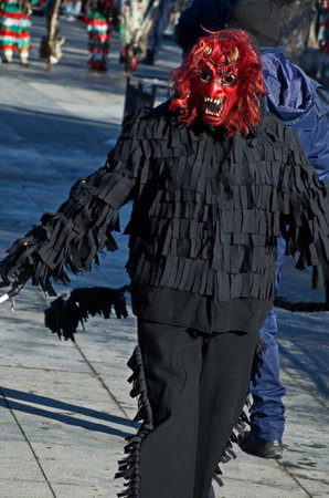 Volunteer mummers, pantomime artists of nature games, roam the town in a traditional custom, Sofia, Bulgariaの写真素材