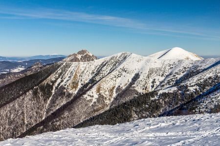 Snowy landscape view of hills from national park Mala Fatra in Slovakia, central Europe.の写真素材